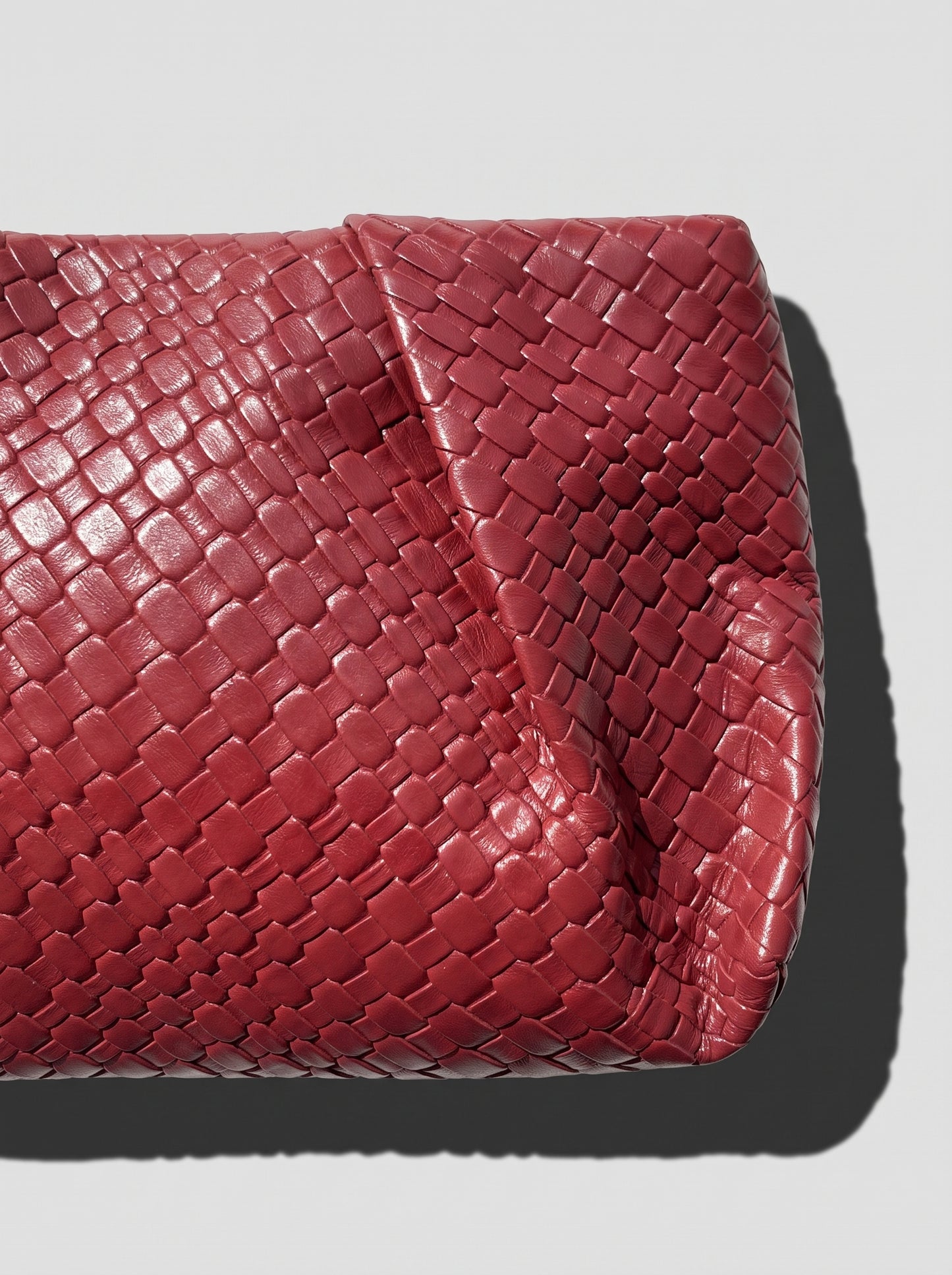Black braided clutch bag