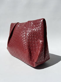 Black braided clutch bag