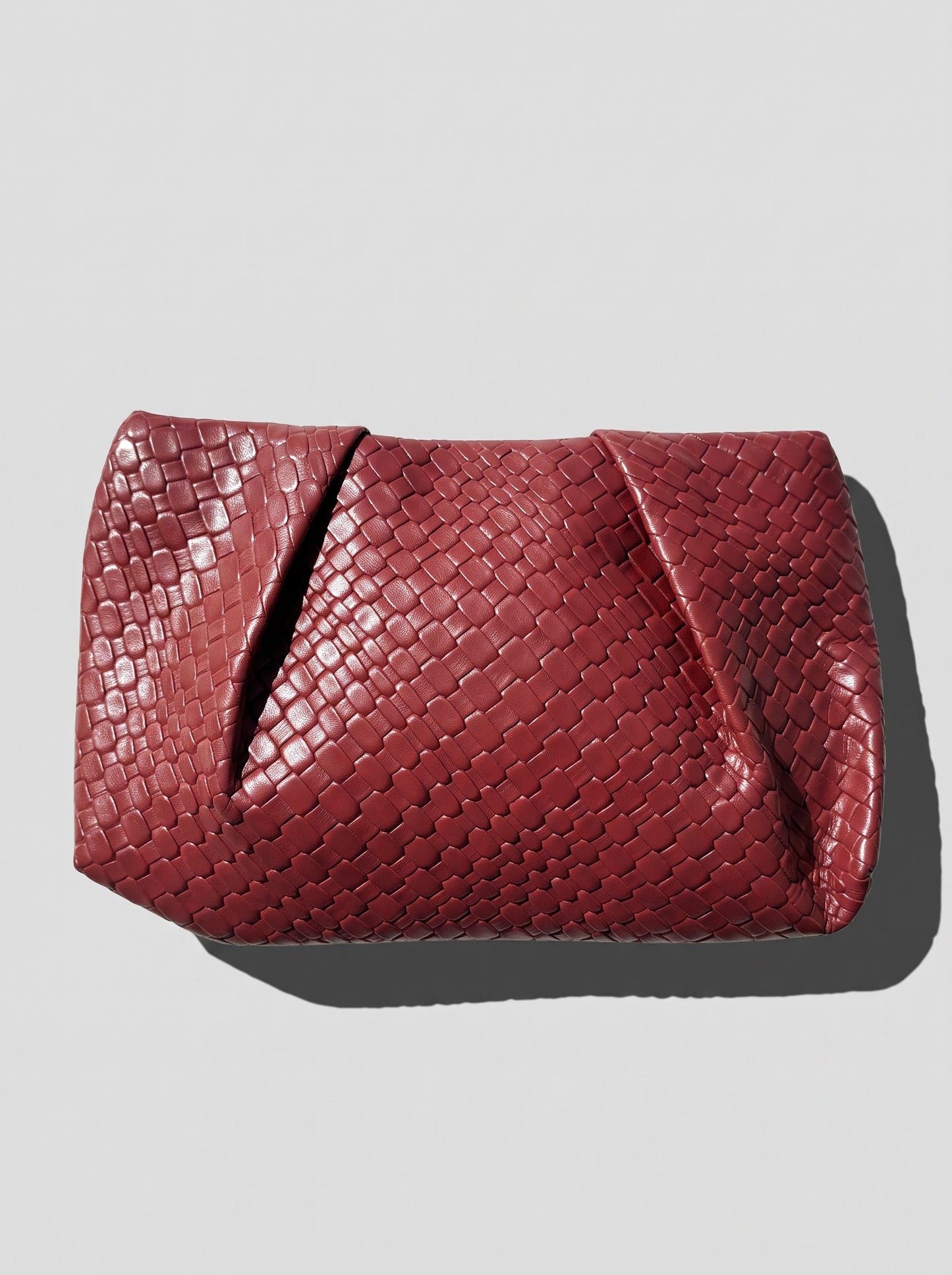 Black braided clutch bag