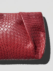 Black braided clutch bag
